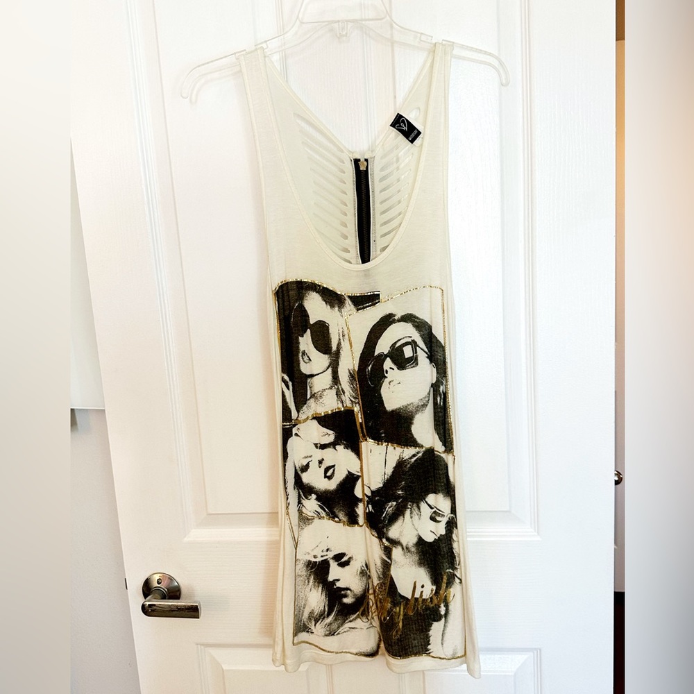 Cream, black, and gold oversized rocker tee